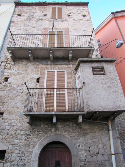 Stone town house in the center of a small hamlet. 1