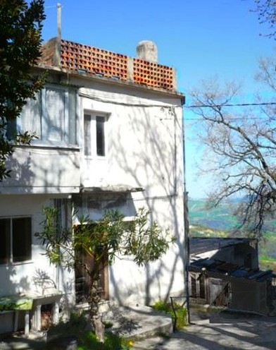 Terraced, stone, farm house, with six rooms and terrace offering open valley views. 1